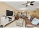 Open-concept living room with comfortable seating and view into the dining area at 1801 E Lake Rd # 11A, Palm Harbor, FL 34685
