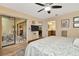 Main bedroom with en-suite bathroom and sliding glass doors to screened area at 1801 E Lake Rd # 11A, Palm Harbor, FL 34685