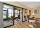 Enclosed lanai with comfortable seating and views into the main living area and outdoors at 1801 E Lake Rd # 11A, Palm Harbor, FL 34685