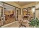 Covered outdoor seating area with view of the living area and a bedroom at 1801 E Lake Rd # 11A, Palm Harbor, FL 34685