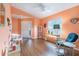 Inviting living room featuring wood floors, cheerful wall colors, and comfortable seating at 18155 Canal Pointe St, Tampa, FL 33647