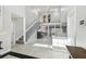 Bright foyer with soaring ceilings, showcasing the home's open floor plan and modern staircase at 1902 Sweet Bay Ct, Plant City, FL 33566