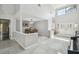 A bright foyer with modern decor and views to the dining area and entry at 1902 Sweet Bay Ct, Plant City, FL 33566