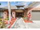 Close up of the home's charming entrance and the attached two car garage at 1902 Sweet Bay Ct, Plant City, FL 33566