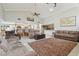 Open-concept living room featuring vaulted ceilings, tile floors, and comfortable seating at 1902 Sweet Bay Ct, Plant City, FL 33566
