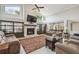 Cozy living room showcasing a fireplace, built-in cabinets, and comfortable seating at 1902 Sweet Bay Ct, Plant City, FL 33566