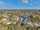 Aerial view highlighting a single-story home with a well-manicured yard in a peaceful neighborhood at 20036 Bluff Oak Blvd, Tampa, FL 33647