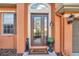 Inviting front door with a glass insert, decorative lighting, and a 'Welcome' mat, plus a dog statue at 20036 Bluff Oak Blvd, Tampa, FL 33647