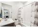 Full bathroom with a tub and shower, and a laundry room view at 20237 Bandera Pl, Venice, FL 34293