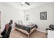 Inviting bedroom with a comfortable bed, chair, desk, and ceiling fan at 20237 Bandera Pl, Venice, FL 34293