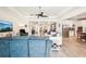 Spacious living room with modern furnishings, ceiling fan, and plenty of natural light at 20237 Bandera Pl, Venice, FL 34293