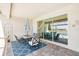 Cozy outdoor patio features a dining area with an umbrella and view of the water at 20237 Bandera Pl, Venice, FL 34293