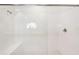 Bright and modern walk-in shower with white tile and glass enclosure at 20237 Bandera Pl, Venice, FL 34293