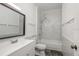 Bathroom featuring a shower over tub with marble-style tile at 2171 Portofino Place # 27-2725, Palm Harbor, FL 34682