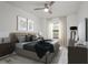 Bedroom with a large bed, decorative wall art, and luxury vinyl plank flooring at 2171 Portofino Place # 27-2725, Palm Harbor, FL 34682
