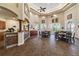 Spacious clubhouse area featuring multiple tables, high ceilings, and a bar area for entertaining guests at 2171 Portofino Place # 27-2725, Palm Harbor, FL 34682