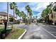 Gated community entrance with lush greenery and a grand entrance, providing privacy and security for residents at 2171 Portofino Place # 27-2725, Palm Harbor, FL 34682