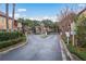 Gated community entrance ensuring security and privacy, with well-maintained landscaping and clear signage at 2171 Portofino Place # 27-2725, Palm Harbor, FL 34682