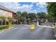 Gated community entrance with security features and well-maintained landscaping at 2171 Portofino Place # 27-2725, Palm Harbor, FL 34682