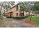 This well-manicured home has colorful accents and a screened-in balcony at 2171 Portofino Place # 27-2725, Palm Harbor, FL 34682