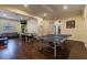 Game room with tv, seating, and games like ping pong for resident enjoyment at 2171 Portofino Place # 27-2725, Palm Harbor, FL 34682