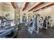 Spacious gym features modern weight training machines, treadmills, and ample natural light at 2171 Portofino Place # 27-2725, Palm Harbor, FL 34682
