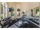 Bright and airy fitness center with mirrored walls, free weights, and large windows at 2171 Portofino Place # 27-2725, Palm Harbor, FL 34682