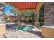 Relaxing hot tub area with shaded pergola and stone pillars near the pool at 2171 Portofino Place # 27-2725, Palm Harbor, FL 34682