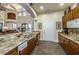 Amenity Center kitchen area featuring stone countertops and stainless steel sink at 2171 Portofino Place # 27-2725, Palm Harbor, FL 34682
