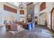 Grand lobby with high ceilings, stone fireplace, comfortable seating, and elegant decor at 2171 Portofino Place # 27-2725, Palm Harbor, FL 34682