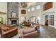 Amenity Center lounge area featuring a fireplace, comfortable seating, and decor at 2171 Portofino Place # 27-2725, Palm Harbor, FL 34682