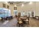 Inviting lounge features comfortable seating, ample natural light, and a bookshelf at 2171 Portofino Place # 27-2725, Palm Harbor, FL 34682