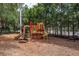 Community playground featuring slides, climbing structures, and wood chip ground cover at 2171 Portofino Place # 27-2725, Palm Harbor, FL 34682