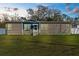 Charming single-story home featuring a well-maintained lawn and tidy landscaping at 21826 Pineywood Loop, Land O Lakes, FL 34639