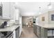 Bright, open kitchen flows into dining area with lots of counter space for meal prep at 21826 Pineywood Loop, Land O Lakes, FL 34639