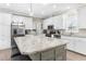 Updated kitchen features a large island, ample storage, and stainless steel appliances at 21826 Pineywood Loop, Land O Lakes, FL 34639