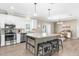 Spacious kitchen with stainless steel appliances, a large island, and lots of natural light at 21826 Pineywood Loop, Land O Lakes, FL 34639