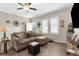 Comfortable living room with wood flooring, white trim, and lots of natural light at 21826 Pineywood Loop, Land O Lakes, FL 34639