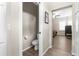 Powder room featuring a toilet, tiled flooring, and access to the bedroom and bathroom at 21826 Pineywood Loop, Land O Lakes, FL 34639