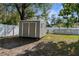 Storage shed in the backyard offering practical outdoor solutions, and an inground pool at 21826 Pineywood Loop, Land O Lakes, FL 34639