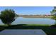 Scenic backyard view of the lake and surrounding community homes at 2411 Paravane Way, Wesley Chapel, FL 33543