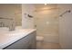 Bathroom featuring a vanity with a modern sink and a combined tub and shower at 2411 Paravane Way, Wesley Chapel, FL 33543