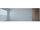 Bright bedroom with a window and white walls, offering a simple and clean space at 2411 Paravane Way, Wesley Chapel, FL 33543
