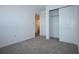 Bedroom featuring plush carpeting, a sliding door closet, and a door to the hallway at 2411 Paravane Way, Wesley Chapel, FL 33543
