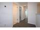 Upstairs hallway leading to bedrooms and baths with wood flooring and white trim at 2411 Paravane Way, Wesley Chapel, FL 33543
