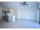 Open concept kitchen with view into living area and outdoor scenery at 2411 Paravane Way, Wesley Chapel, FL 33543