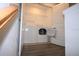 Upstairs laundry closet featuring side by side washer and dryer with wire rack at 2411 Paravane Way, Wesley Chapel, FL 33543