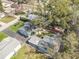 Wide aerial shot of the home, showing its location amidst a neighborhood setting at 306 W Alva St, Tampa, FL 33603