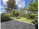 Beautiful backyard with mature trees, lush greenery, a stone tile patio, and a peaceful atmosphere at 3205 Majestic View Dr, Lutz, FL 33558