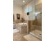 Bathroom with soaking tub and separate glass-enclosed shower at 3205 Majestic View Dr, Lutz, FL 33558